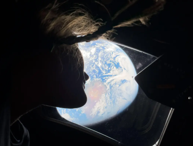 a stunning image of NASA astronauts looking back at Earth through the Orion spacecraft window went viral.